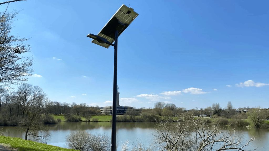 Solar street light by a river.