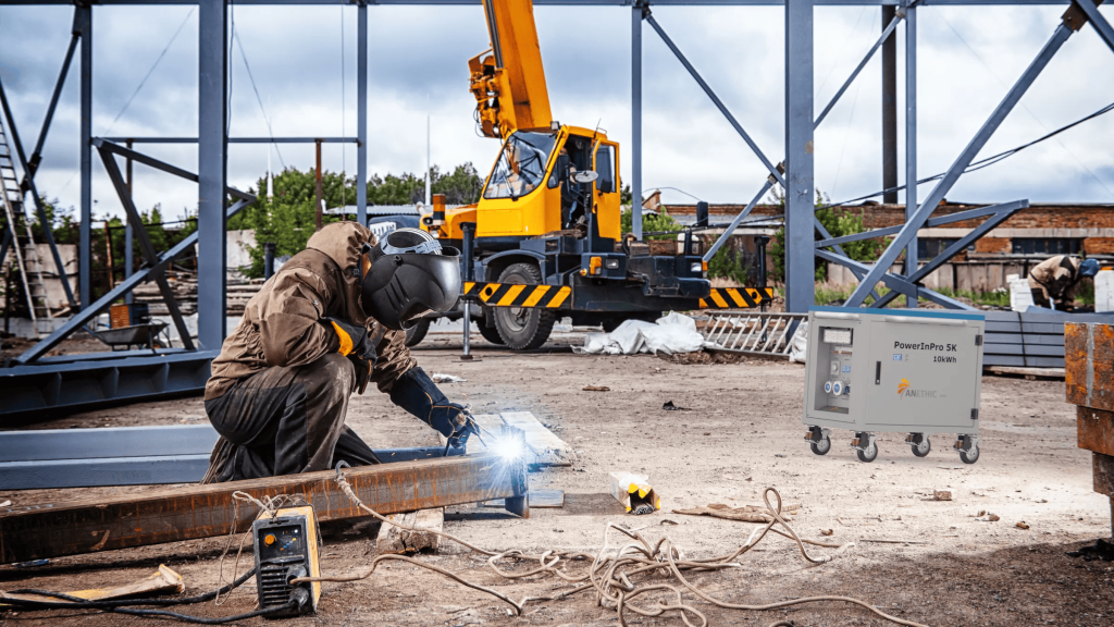 Worker welding in construction site.